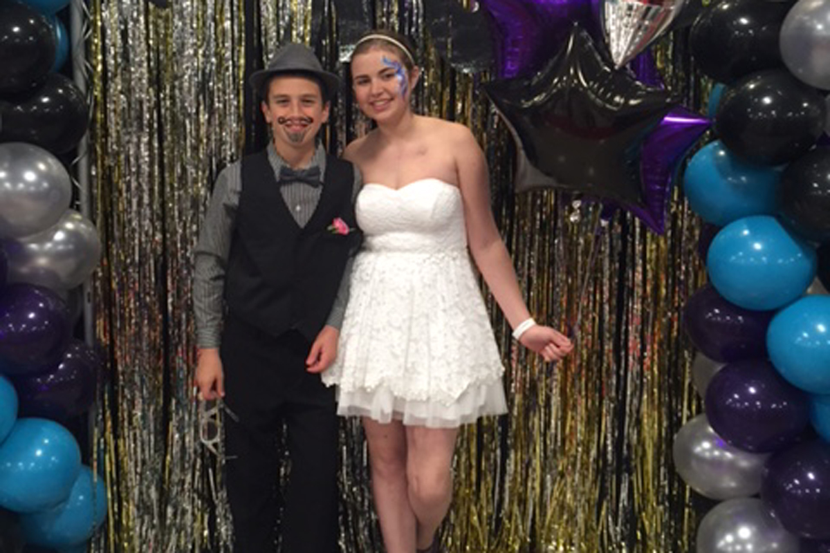 Memorial Sloan Kettering osteosarcoma patient Grace Franzese and her younger brother at the Department of Pediatrics' prom.