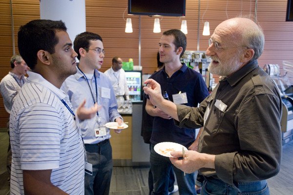 First-year PhD student Prashant Monian (front left) and faculty member Chris Sander and first-year student Daniel Marks (back left) with faculty member Iestyn Whitehouse at the July 27 Welcome Reception for first-year students.