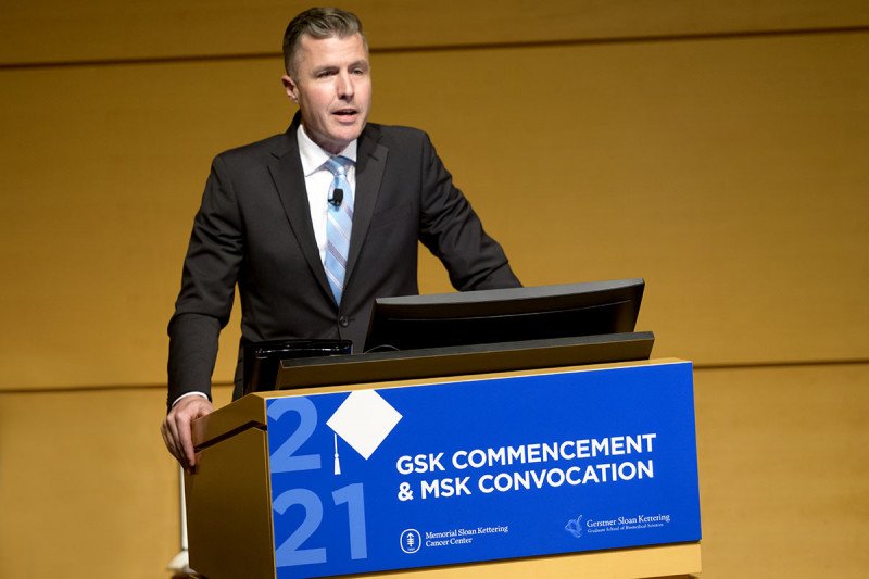 GSK Dean Michael Overholtzer stands at the podium