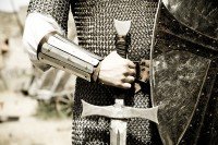 a man holding a shield and sword