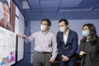 Researchers Gary Dixon (on TV monitor), Heng Pan, Olivier Elemento, and Danwei Huangfu in the lab