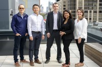 Jianjiong Gao, Hongxin Zhang, Nikolaus Schultz, Debyani Chakravarty, and Sarah Suehnholz stand together on a terrace