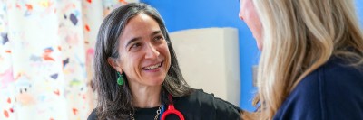 Chief attending Pediatrics Maria Luisa Sulis, MD, MS (left) talks with Kateri McGuire, APP III in Pediatrics at MSK Kids. 