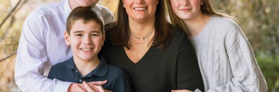 MSK patient Jen Cosgrove is seen smiling with her three children. 